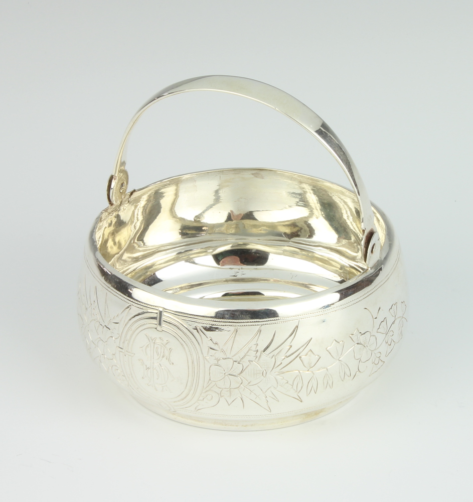 A Russian silver swing handled basket with chased floral decoration and monogram 109 gramsThe handle
