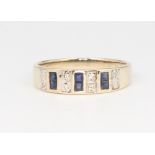 A 9ct yellow gold princess cut sapphire and brilliant cut diamond ring 2.1 grams, size P 1/2