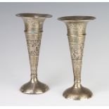 A pair of Eastern silver tapered posy vases decorated with flowers and figures 17cm 260 grams