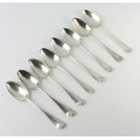 Eight Georgian silver dessert spoons, mixed dates and rubbed marks, 300 grams