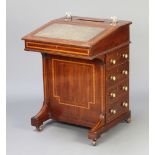 An Edwardian inlaid mahogany Davenport the top fitted a pen recess and 2 inkwell recesses with