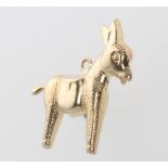 A 9ct yellow gold charm in the form of a donkey, 1.4 grams