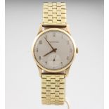 A gentleman's 9ct yellow gold Garrards wristwatch with seconds at 6 o'clock, contained in a 32mm
