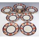 A 19th Century part dessert service decorated in the Imari pattern comprising 5 plates, 3 tazza