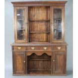 A Victorian oak dog kennel dresser, the upper section with moulded cornice fitted 2 shelves