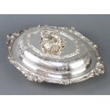 A Victorian silver plated entree dish with cast vinous handle and chased decoration 36cm