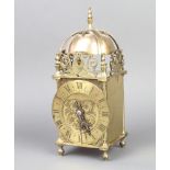 A French 1920's striking lantern clock having a 12cm dial with Roman numerals, the back plate marked