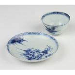 A Nanking Cargo tea bowl and saucer decorated with landscape views, having original Christies
