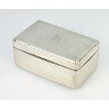 A rectangular engine turned silver cigarette box with engraved crest Birmingham 1925, 14cm This item