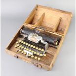 A Blick aluminium featherweight typewriter complete with carrying case (there is light rust to the