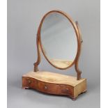 A 19th Century oval plate dressing table mirror contained in a mahogany frame, the inlaid bleached