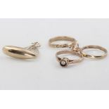 Two 9ct yellow gold charms of a yacht and 3 rings, 1.6 grams