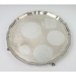 A silver salver with Chippendale rim on claw and ball feet Birmingham 1936, 35cm, 1360 grams