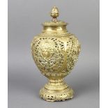 A Victorian pierced brass urn shaped incense burner raised on a circular foot 26cm h x 12cm diam.