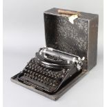An Underwood noiseless portable manual typewriter complete with carrying case