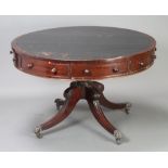 A circular Georgian mahogany drum table with black inset leather writing surface, fitted 5