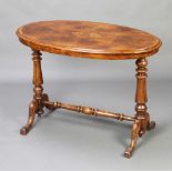 A Victorian inlaid quarter oyster walnut veneered and crossbanded stretcher table raised on turned