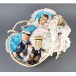 Two Norah Wellings felt figures of sailors 20cm together with 3 dolls contained in a Moses basket