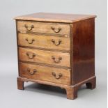 A Georgian bleached mahogany chest of 4 drawers with brass ring neck drop handles, raised on bracket