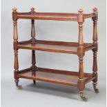 A Victorian rectangular mahogany 3 tier bookcase raised on bulbous turned supports with brass