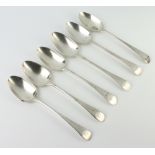 Six Georgian silver table spoons with bright cut decoration, mixed dates, rubbed marks, 355 grams