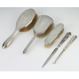 An Art Deco silver backed hair brush and clothes brush rubbed marks, 3 other mounted items