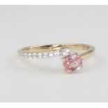 A 9ct yellow gold pink sapphire and diamond ring 1.5 grams, size N 1/2