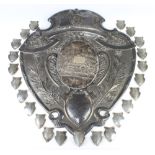 An impressive repousse silver shield engraved "Annual Competition District Teams Collection of