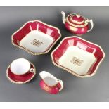 A Spode bone china part tea set, the burgundy and gilt decoration with the crest of The Worshipful