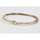 A 9ct yellow gold diamond bangle 9.9 grams, 0.10ct