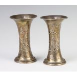 A pair of silver Art Nouveau flared neck vases decorated with flowers Birmingham 1912, 12cm, with