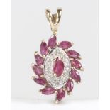 A 9ct yellow gold ruby and diamond pendant, 20mm, 1.4 grams