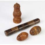 A 19th Century Continental turned wood needle case, a coquilla nut needle holder 12cm and 2