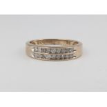 A 9ct yellow gold diamond double band half eternity ring, approx 0.33ct, 2.7 grams, size O 1/2