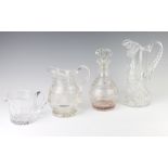 A cut glass baluster water jug 18cm, a squat jug 11cm, a ewer 27cm and a mallet shaped decanter with