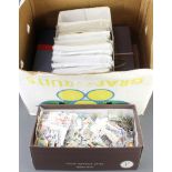 Two shoe boxes of loose stamps and a shoe box of PHQ cards