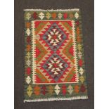 A tan, black and brown ground Maimana Kilim rug 87cm x 57cm