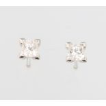 A pair of 18ct white gold princess cut diamond ear studs, approx. 0.51ct, colour G/H clarity VS