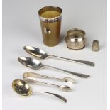 A silver mounted horn beaker, 3 spoons, a pair of sugar tongs, napkin ring and thimble, weighable