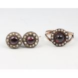 A yellow gold cabochon garnet and seed pearl ring size N together with a pair of similar earrings,