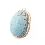 An Egyptian yellow gold mounted, carved turquoise scarab pendant 7.6 grams, 30mm