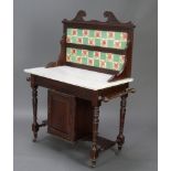 A Victorian mahogany wash stand with raised tiled back and white veined marble top, raised on turned