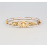 A 9ct yellow gold pearl set bangle, 15.5 grams