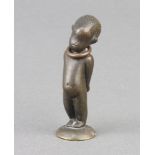 A bronze seal in the form of a standing child base marked WHM 5cm x 1cm