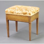 An Edwardian rectangular inlaid bleached mahogany piano stool with over stuffed seats, on square