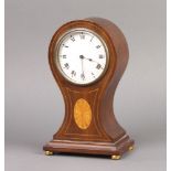 An Edwardian French bedroom timepiece with enamelled dial and Roman numerals contained in an