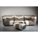 A LEATHER THREE PIECE SUITE, possibly by Ligne Roset, comprising a pair of corner pieces and a
