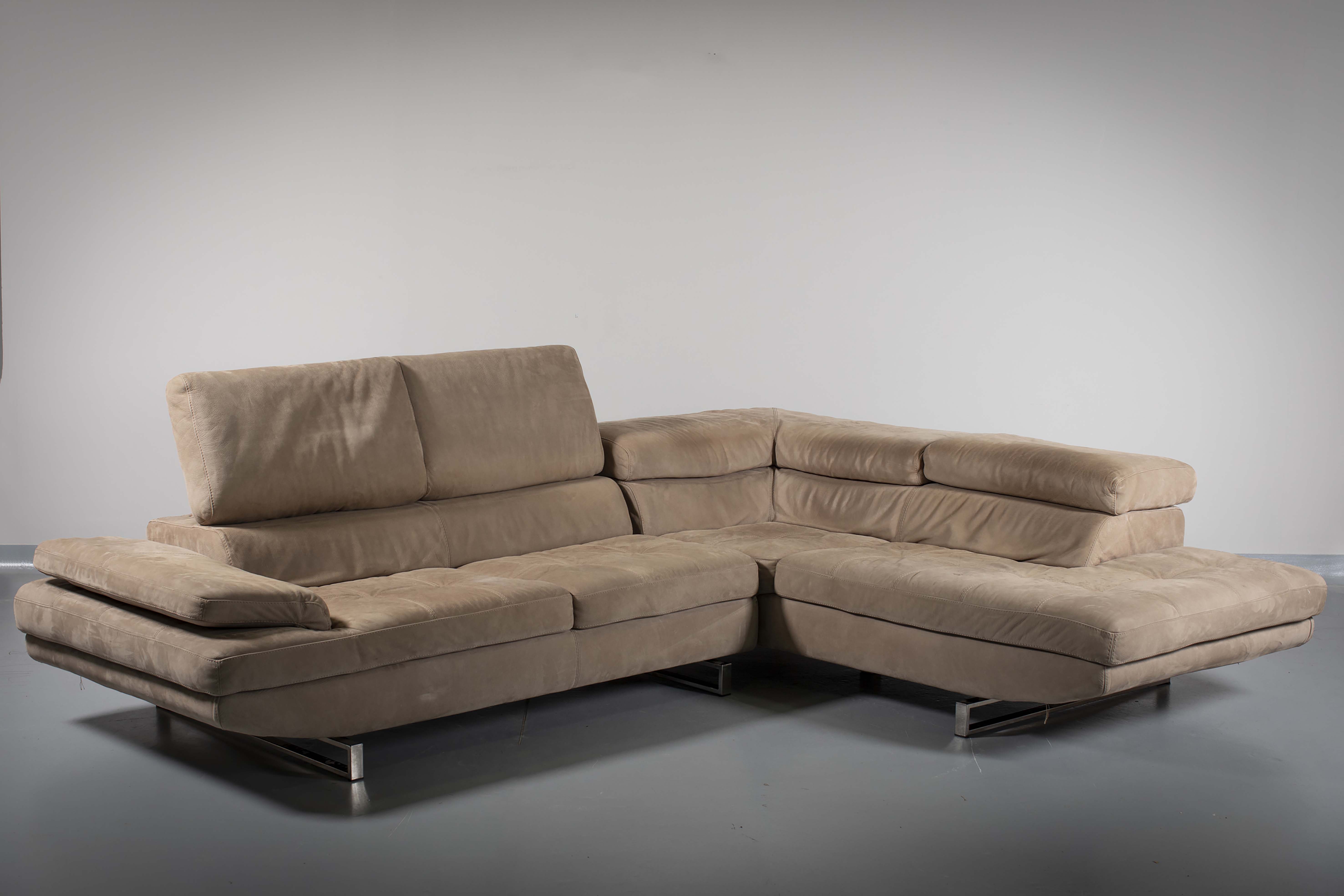 AN ITALIAN LEATHER L-SHAPED HABART SOFA, BY MAX DIVANI, with adjustable head rests, on chrome bases,