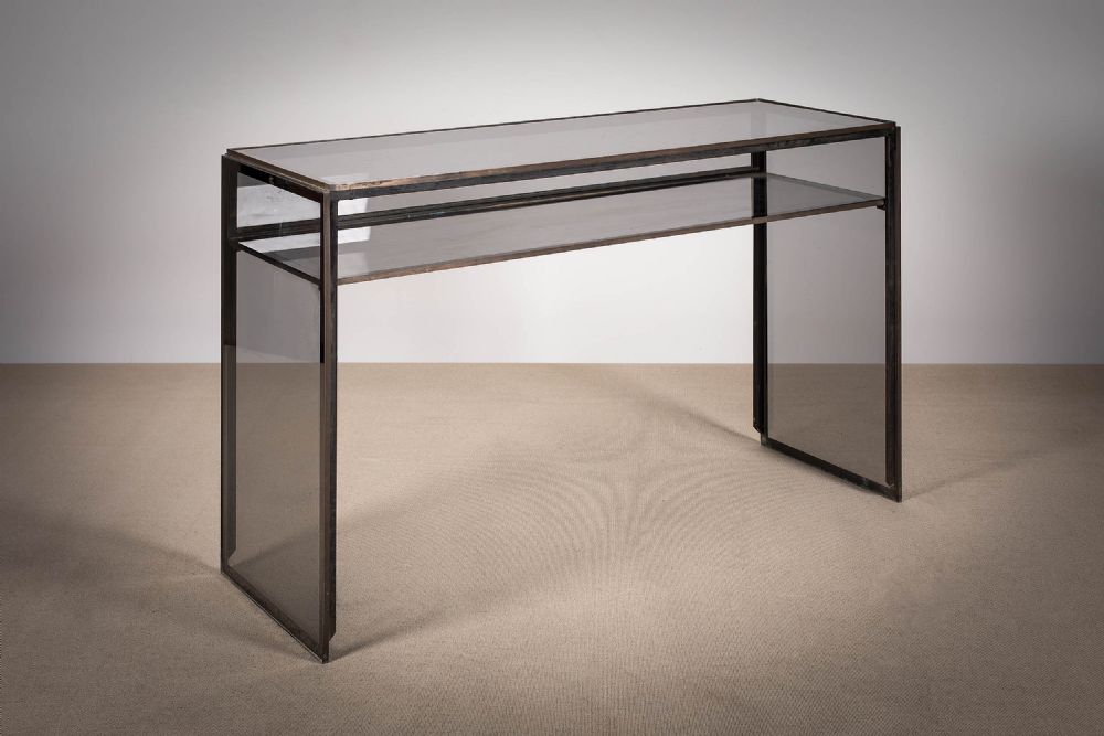 A CHROME AND SMOKED GLASS CONSOLE TABLE, 1970s, the square ends with tiered shelf, 123cm (w) x