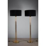 A PAIR OF TUBULAR BRASS STANDARD LAMPS, 1970s, on circular bases, each 177cm (h).